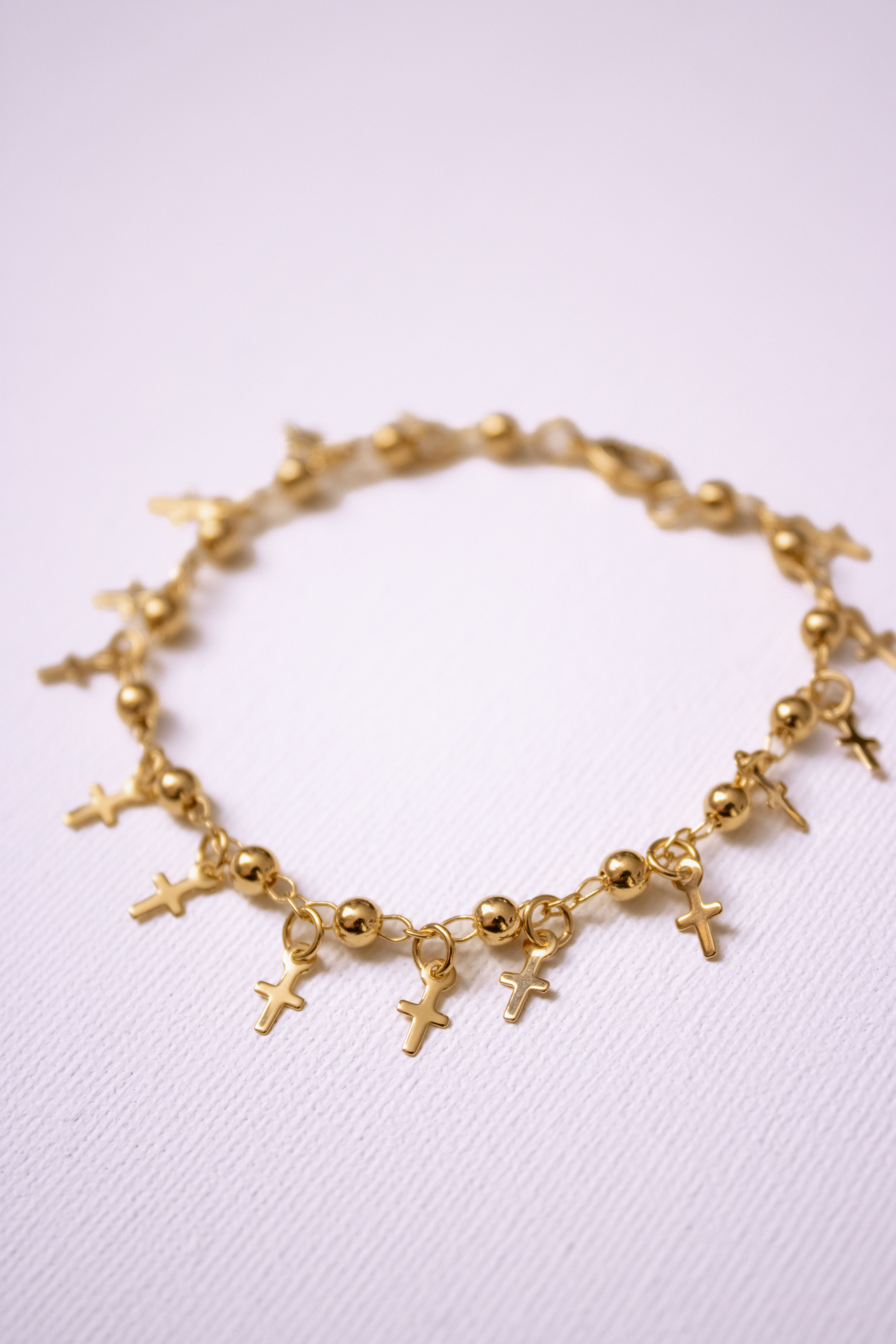 Cross bracelet (18kGF)